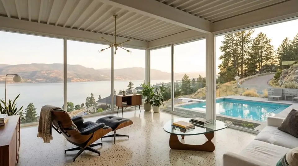 Stahl House · The corner: Glass-corner living room: Eames chair, Noguchi table, lake in two directions.