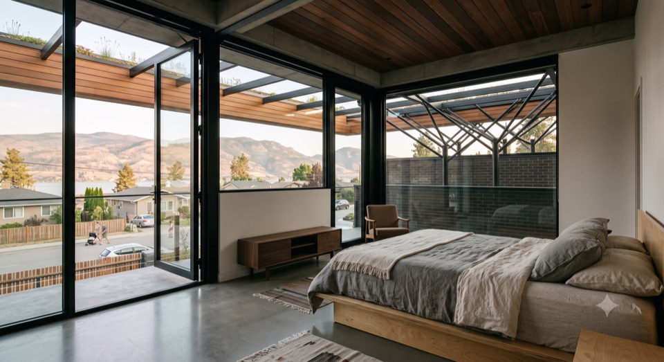 A quiet bedroom that opens to the outdoors.